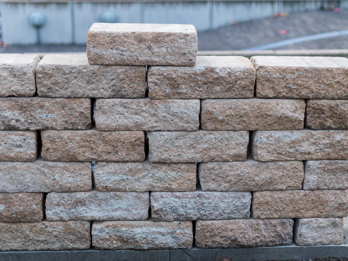 A stone retaining wall in a garden